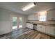 Updated Kitchen with stainless appliances, granite counters, and french doors at 3563 Brenda Ct, Douglasville, GA 30135