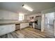 Bright kitchen featuring stainless appliances, white cabinets and wood floors at 3563 Brenda Ct, Douglasville, GA 30135