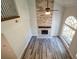 Spacious living room featuring hardwood floors, stone fireplace, ceiling fan and large window for natural light at 3563 Brenda Ct, Douglasville, GA 30135