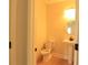 Small half bathroom with white fixtures and light wood flooring at 3877 Lake Sanctuary Way, Atlanta, GA 30349