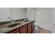 Bathroom includes double sinks, a toilet, and a shower-tub combo at 3877 Lake Sanctuary Way, Atlanta, GA 30349