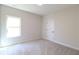 Comfortable bedroom with bright window and carpet at 3877 Lake Sanctuary Way, Atlanta, GA 30349