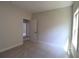 Well lit room with a view to another bedroom, offers a comfortable space with carpeted flooring at 3877 Lake Sanctuary Way, Atlanta, GA 30349