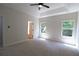 Spacious bedroom with a ceiling fan and well-lit with natural light at 3877 Lake Sanctuary Way, Atlanta, GA 30349