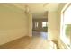 Bright dining room with light wood floors, chandelier and wainscoting at 3877 Lake Sanctuary Way, Atlanta, GA 30349
