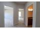Hallway showcases bedrooms and bathroom, highlighting neutral tones and carpet at 3877 Lake Sanctuary Way, Atlanta, GA 30349