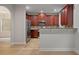 Modern kitchen featuring stainless steel appliances, granite countertops, and wooden cabinets at 3877 Lake Sanctuary Way, Atlanta, GA 30349