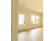 Bright living room with light wood floors, a door and a window at 3877 Lake Sanctuary Way, Atlanta, GA 30349