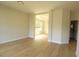 Bright, spacious living room with light wood floors and recessed lighting at 3877 Lake Sanctuary Way, Atlanta, GA 30349