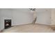 Open living room with fireplace, light wood floors, and staircase leading to the upper level at 3877 Lake Sanctuary Way, Atlanta, GA 30349