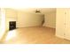 Spacious living room featuring a fireplace, ceiling fan, and elegant staircase at 3877 Lake Sanctuary Way, Atlanta, GA 30349