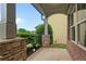 Inviting porch with stone accents and column details, offering a charming entrance to the home at 3877 Lake Sanctuary Way, Atlanta, GA 30349