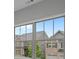 Bright windows provide a picturesque neighborhood view at 3877 Lake Sanctuary Way, Atlanta, GA 30349
