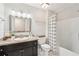 Bathroom featuring a granite countertop vanity and a shower with curtain at 5259 Sugar Ridge Dr, Sugar Hill, GA 30518