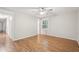 Bright bedroom with hardwood floors and a ceiling fan for comfortable living at 5259 Sugar Ridge Dr, Sugar Hill, GA 30518