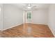 Bright bedroom with hardwood floors and a ceiling fan for comfortable living at 5259 Sugar Ridge Dr, Sugar Hill, GA 30518