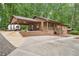 Charming single-Gathering home with a covered carport and inviting front porch at 5259 Sugar Ridge Dr, Sugar Hill, GA 30518