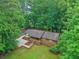 Charming single-story home with a landscaped yard and mature trees creating a private setting at 5259 Sugar Ridge Dr, Sugar Hill, GA 30518