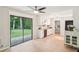 Bright kitchen features white cabinets, stainless steel appliances, and access to the backyard at 5259 Sugar Ridge Dr, Sugar Hill, GA 30518