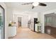 Bright kitchen features white cabinets, stainless steel appliances, and light colored tile flooring at 5259 Sugar Ridge Dr, Sugar Hill, GA 30518