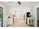 Inviting kitchen featuring stainless steel appliances, granite countertops, and white cabinets overlooking the backyard at 5259 Sugar Ridge Dr, Sugar Hill, GA 30518