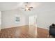 Bright living room with hardwood floors, a vaulted ceiling, and ceiling fan at 5259 Sugar Ridge Dr, Sugar Hill, GA 30518