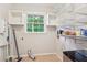 Pantry with ample storage, featuring wire shelving, wall cabinets, and a window at 5259 Sugar Ridge Dr, Sugar Hill, GA 30518