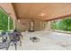 Spacious covered patio with multiple seating arrangements for outdoor relaxation at 5259 Sugar Ridge Dr, Sugar Hill, GA 30518