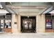 Exterior view of the building's entrance, showcasing modern architecture and street-level accessibility at 800 Peachtree Ne St # 8429, Atlanta, GA 30308