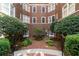 Charming brick courtyard with landscaped greenery and pathways, creating a peaceful outdoor space at 800 Peachtree Ne St # 8429, Atlanta, GA 30308