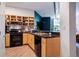 Modern kitchen featuring stainless steel appliances, light wood cabinets, and beautiful hardwood flooring at 800 Peachtree Ne St # 8429, Atlanta, GA 30308