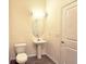 This bathroom offers a toilet, sink, vanity mirror, and white door at 870 Mayson Turner Nw Rd # 1447, Atlanta, GA 30314