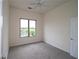 This bedroom has carpet floors, a window, and a ceiling fan at 870 Mayson Turner Nw Rd # 1447, Atlanta, GA 30314