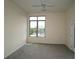 Bedroom with carpet, large window and door to balcony at 870 Mayson Turner Nw Rd # 1447, Atlanta, GA 30314