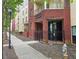 Brick building with the name 'The Washington' in front of entrance with a black metal fence and lamp post on the sidewalk at 870 Mayson Turner Nw Rd # 1447, Atlanta, GA 30314