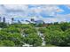 Scenic view of the city skyline, lush green trees, and beautiful clouds above buildings at 870 Mayson Turner Nw Rd # 1447, Atlanta, GA 30314