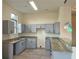 Kitchen featuring gray cabinets, granite countertops, and stainless steel sink with view of pendant lights at 870 Mayson Turner Nw Rd # 1447, Atlanta, GA 30314