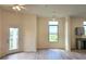 Living room with wood floors, ceiling fan, door to balcony, and kitchen in background at 870 Mayson Turner Nw Rd # 1447, Atlanta, GA 30314