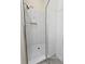 This modern shower features stylish tile, a glass door, and shower caddy at 870 Mayson Turner Nw Rd # 1447, Atlanta, GA 30314