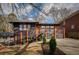 Modern, two-story home with a black brick facade, and a well-manicured landscaped front yard at 1605 Ezra Church Nw Dr, Atlanta, GA 30314