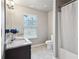 Bright bathroom offers granite double sinks, tile flooring, and shower/tub combination at 1867 Castleberry Ln, Buford, GA 30518