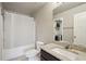 This bathroom features a white shower curtain, light granite countertop and storage shelves at 1867 Castleberry Ln, Buford, GA 30518