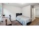 A charming bedroom with hard wood floors features natural light and access to an ensuite bathroom at 1867 Castleberry Ln, Buford, GA 30518