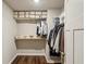 Walk-in closet with wood floor, shelving and racks for optimal storage at 1867 Castleberry Ln, Buford, GA 30518