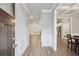 Inviting foyer with wood-look flooring, wainscoting detail, and views into the living spaces at 1867 Castleberry Ln, Buford, GA 30518