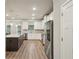 Bright and spacious kitchen with stainless steel appliances, a large island, and ample counter space at 1867 Castleberry Ln, Buford, GA 30518