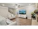 Cozy living room featuring neutral paint, recessed lighting, fireplace, and wood-look flooring at 1867 Castleberry Ln, Buford, GA 30518