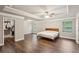 Spacious main bedroom with hardwood floors, tray ceiling, walk-in closet and lots of windows at 1867 Castleberry Ln, Buford, GA 30518