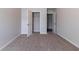 Spacious bedroom with plush carpet, open closets, and soothing neutral walls at 204 Saintvry Path, Atlanta, GA 30349