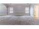 Spacious carpeted bedroom with natural light and neutral colors at 204 Saintvry Path, Atlanta, GA 30349
